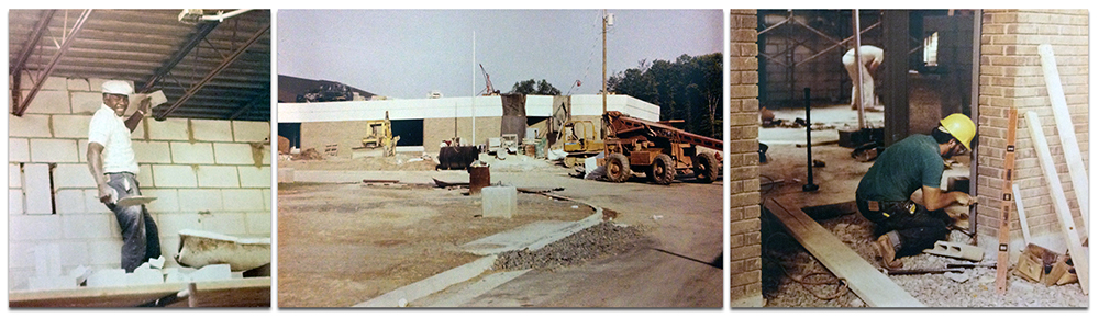 Compilation of three photographs of Armstrong Elementary during construction. The first image on the left shows a workman smiling at the camera. He is placing cinderblock at the top of a wall where is meets the metal ceiling and support beams. The middle photograph shows an exterior view of the building with heavy construction equipment parked out front. Construction materials are scattered throughout the site. The third photograph shows a workman wearing a yellow hardhat working on a portion of an interior brick wall. A second workman is visible in the distance. 